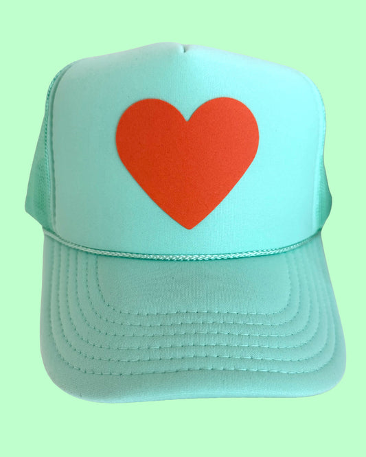 Orange heart 🧡 on mint green hat (The Life of a Showgirl colors)